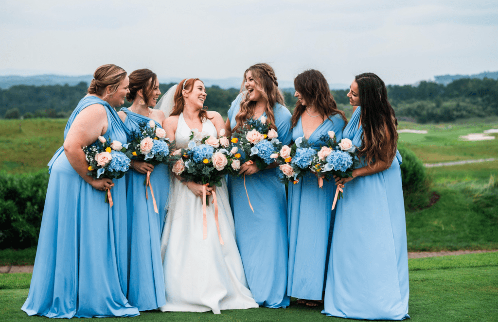Bridesmaids holding their real-touch bouquets