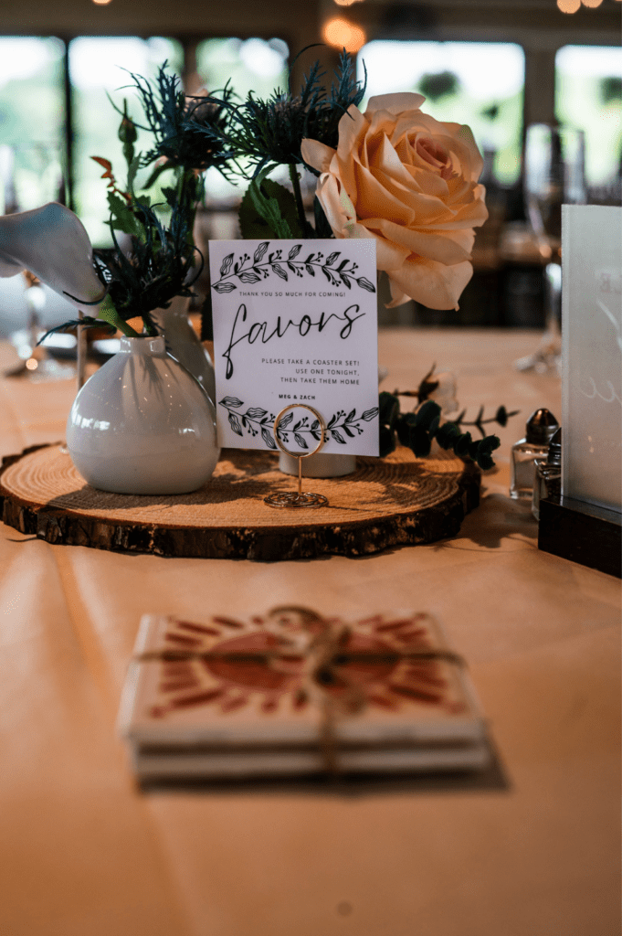 Close-up of the wood slice centerpieces with bud vases