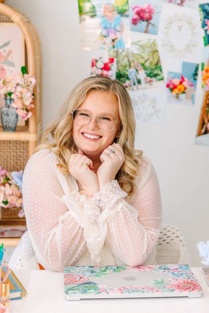 florist sitting at desk smiling at camera